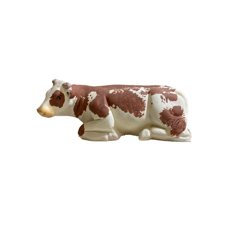 la vache marron couchée