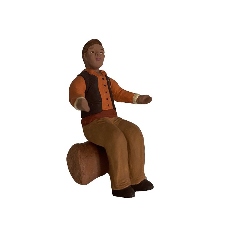 l'homme assis bras écartés